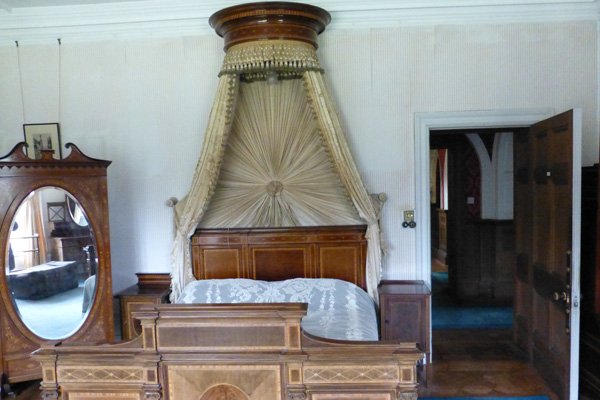 Sir George's bedroom with inlaid mahogany bed