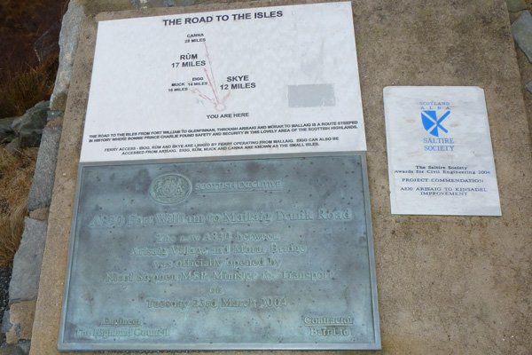 The nearby plaque commemorating the A830 Trunk Road
