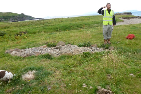 A member of The Ardnamurchan Transitions Project talking about the Viking Boat Burial Site during an open day in 2012