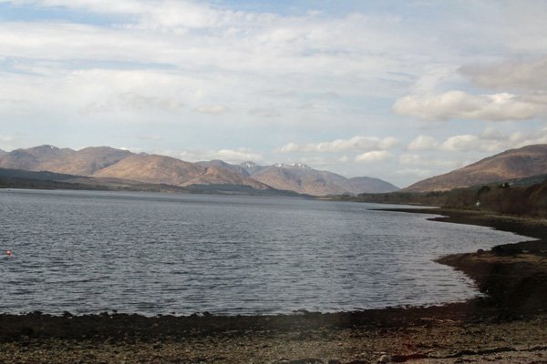 The train passes close by the shore of Loch Eil, a sea loch joining into Loch Linnhe