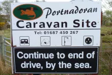 The sign for Portnadoran Caravan Site
