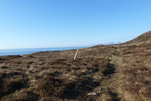 The footpath to the beach crosses heathland
