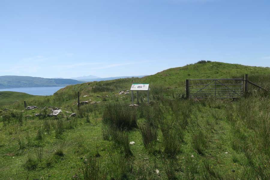 Heritage Ardnamurchan signage at the entrance to the field