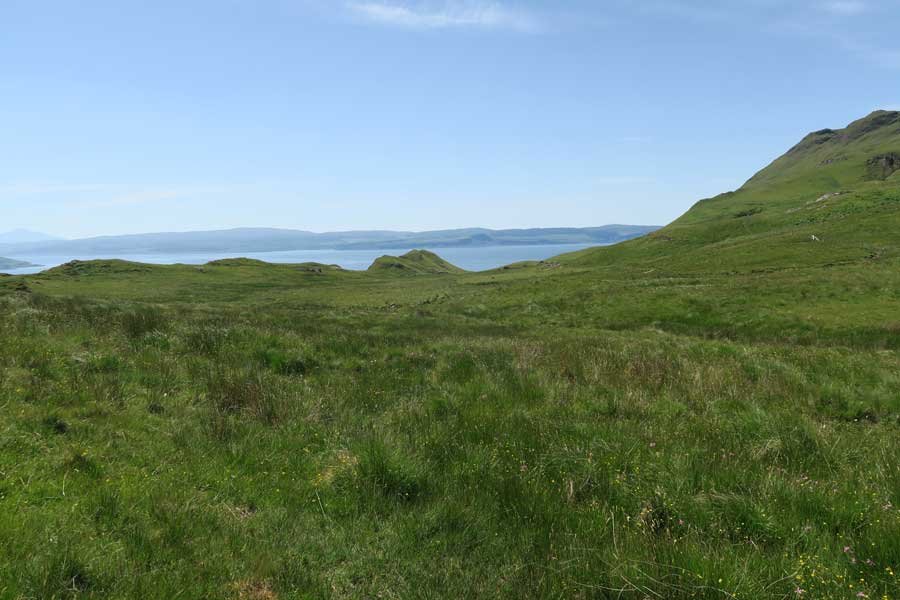 Cross the large grassland pasture to Bourblaige