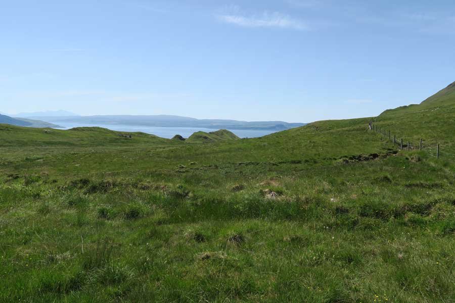 You can follow the fenceline down to the village, though it is boggy