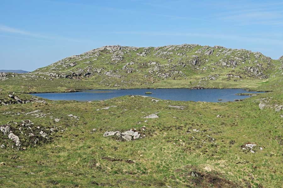 Head off the main path towards the wee lochan in the hills