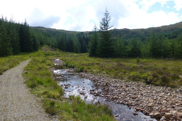 The path skirts by the little stream Allt Coire an t-Suidhe