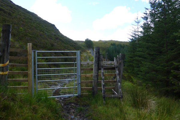 Passing through a gate continuing on the path towards Strontain