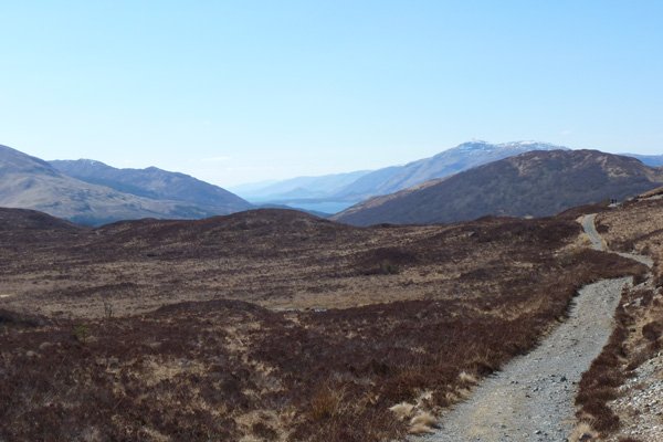 Crossing a lovely section heathland with fine views of the Nevis Rangee
