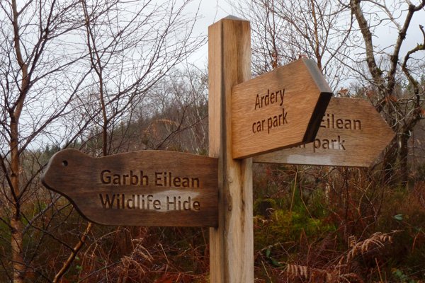 signs to the two car parks and otter hide