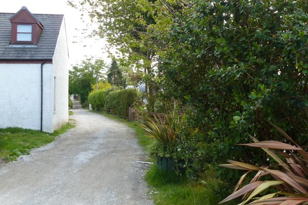 Start of the walk on track by houses, Port Appin